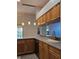 Kitchen with stainless steel appliances, counter seating and lots of natural light at 3700 Plantation Blvd, Leesburg, FL 34748