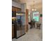 View of a kitchen featuring stainless steel appliances and a window overlooking the backyard at 3700 Plantation Blvd, Leesburg, FL 34748