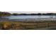 This image features a serene lake view from a property, adding natural beauty and tranquility at 3700 Plantation Blvd, Leesburg, FL 34748