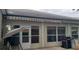 Screened-in patio with retractable awning, barbecue, and comfortable seating at 3700 Plantation Blvd, Leesburg, FL 34748