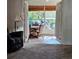 View of an enclosed patio area featuring tile flooring, furniture, and natural light at 3700 Plantation Blvd, Leesburg, FL 34748