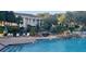 This image displays a pool area with a view of the building, offering relaxation and recreation at 3700 Plantation Blvd, Leesburg, FL 34748