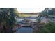 This image captures a community pool with a decorative bridge and lounge chairs, inviting relaxation and recreation at 3700 Plantation Blvd, Leesburg, FL 34748