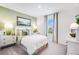 Cozy bedroom with natural light, soft green walls, and neutral furnishings at 4760 Yellow Elder Way, Kissimmee, FL 34758