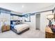 This cozy bedroom is painted with a blue stripe and decorated with sports and basketball-themed décor at 4760 Yellow Elder Way, Kissimmee, FL 34758
