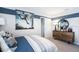 Bedroom with basketball theme featuring a striped accent wall, artwork and dark wood furnishings at 4760 Yellow Elder Way, Kissimmee, FL 34758