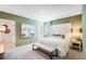 This main bedroom features an inviting color scheme and an accent wall with a decorative painting at 4760 Yellow Elder Way, Kissimmee, FL 34758