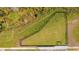 Aerial view of a fenced in backyard with a grassy area at 502 Bogey Dr, Davenport, FL 33896