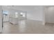 Open-concept space featuring neutral tile flooring, recessed lighting, and a bright kitchen space at 502 Bogey Dr, Davenport, FL 33896