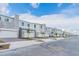 Street view of new townhomes with stone and modern architectural design at 502 Bogey Dr, Davenport, FL 33896