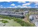 Community aerial view featuring newly constructed townhomes near green spaces and local amenities at 5214 Dragonfly Dr, Wildwood, FL 34785