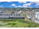 Aerial view of a new community, showcasing modern townhomes and a well-planned neighborhood layout at 5214 Dragonfly Dr, Wildwood, FL 34785