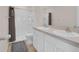 Bathroom featuring a double sink vanity and a stand up shower at 5214 Dragonfly Dr, Wildwood, FL 34785