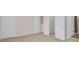 Neutral bedroom with carpet flooring, closet, and ensuite bathroom access at 5214 Dragonfly Dr, Wildwood, FL 34785