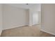 Spacious carpeted bedroom featuring a double closet at 5214 Dragonfly Dr, Wildwood, FL 34785
