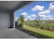 View from the back patio showcasing the serene water view and natural landscaping of the property at 5214 Dragonfly Dr, Wildwood, FL 34785