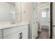 Bathroom with vanity, mirror, and fixtures, and a view into the WC at 5242 Citrus Leaf, Winter Garden, FL 34787