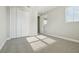 Well-lit bedroom features plush carpet, closet space and large window at 5242 Citrus Leaf, Winter Garden, FL 34787