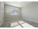 Well-lit bedroom with plush carpet and large window allowing for great natural light at 5242 Citrus Leaf, Winter Garden, FL 34787
