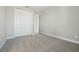 Bright carpeted bedroom features a closet with fresh paint in neutral colors at 5242 Citrus Leaf, Winter Garden, FL 34787
