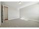 Carpeted bedroom features a large window and an en-suite bathroom at 5242 Citrus Leaf, Winter Garden, FL 34787