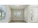 Bright entryway with windows, a white front door, and wood-look tile flooring at 5242 Citrus Leaf, Winter Garden, FL 34787