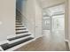 Entry foyer with hardwood floors and stairs leading to the second floor at 5242 Citrus Leaf, Winter Garden, FL 34787