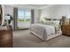 Relaxing main bedroom with a large window and neutral tones at 5242 Citrus Leaf, Winter Garden, FL 34787