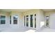 Covered back patio featuring a tiled floor, white trim, and ample light at 5242 Citrus Leaf, Winter Garden, FL 34787