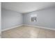 Bedroom featuring a neutral color palette and a bright window at 5325 Curry Ford Rd # G202, Orlando, FL 32812