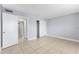 This bedroom has tiled floors, neutral paint, and a sliding door closet at 5325 Curry Ford Rd # G202, Orlando, FL 32812
