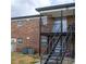 Apartment building with black iron stairs and balcony at 5325 Curry Ford Rd # G202, Orlando, FL 32812