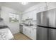 Bright kitchen featuring stainless steel appliances, marble countertops, and white subway tile backsplash at 5325 Curry Ford Rd # G202, Orlando, FL 32812