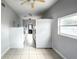 Clean laundry room with tile floors, neutral paint, several ceiling fans and front loading washers and dryers at 5325 Curry Ford Rd # G202, Orlando, FL 32812