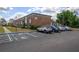 Well maintained parking lot in front of a brick apartment building with blue handicap parking space at 5325 Curry Ford Rd # G202, Orlando, FL 32812