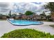 Community pool with a dark blue trim for residents to enjoy at 5325 Curry Ford Rd # G202, Orlando, FL 32812