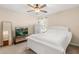 Bright bedroom features a large bed, neutral tones, and ample natural light at 7349 Ella Ln, Windermere, FL 34786