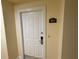 A plain, white door with a number 201 on the wall at 7518 Seven Eagles Way # 201, Reunion, FL 34747
