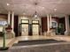 Grand entrance of the hotel features an open foyer and well-maintained exterior at 7518 Seven Eagles Way # 201, Reunion, FL 34747