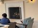 Outdoor fireplace with person sitting nearby at 7518 Seven Eagles Way # 201, Reunion, FL 34747