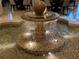 Indoor water fountain with intricate stonework and accent lighting by the dining area at 7518 Seven Eagles Way # 201, Reunion, FL 34747