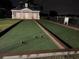 Bocce ball court at night in a well maintained recreational area at 7518 Seven Eagles Way # 201, Reunion, FL 34747