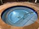 Community hot tub with lights and tiled surround. Has a handrail and stairs for easy access at 7518 Seven Eagles Way # 201, Reunion, FL 34747