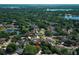 Beautiful aerial view of homes nestled among trees, showcasing the neighborhood's charm and serene setting at 7703 Pine Vista Ct, Orlando, FL 32819