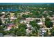 A beautiful neighborhood featuring lush greenery, homes, and a scenic view of a lake at 7703 Pine Vista Ct, Orlando, FL 32819