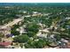Lush greenery surrounds homes and a serene pond in this desirable neighborhood at 7703 Pine Vista Ct, Orlando, FL 32819