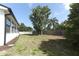 Spacious backyard features a large tree, providing shade and character to the outdoor space at 7703 Pine Vista Ct, Orlando, FL 32819