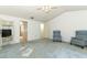 Open bedroom with ceiling fan, blue carpet, and doorways leading to other rooms at 7703 Pine Vista Ct, Orlando, FL 32819