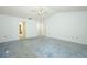 Bright, carpeted bedroom with high ceiling and ensuite access at 7703 Pine Vista Ct, Orlando, FL 32819