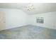 Bright bedroom with a vaulted ceiling and ample space for furniture at 7703 Pine Vista Ct, Orlando, FL 32819